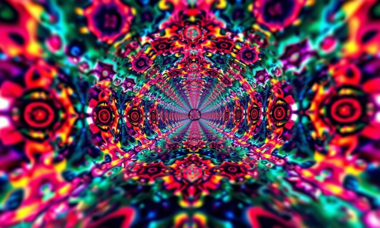 A surreal, kaleidoscopic tunnel of fractal patterns and vibrant hues, stretching infinitely into the distance, bathed in dramatic studio lighting with sharp focus on the foreground, creating a mesm...